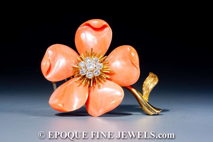 A beautiful coral and diamond flower brooch